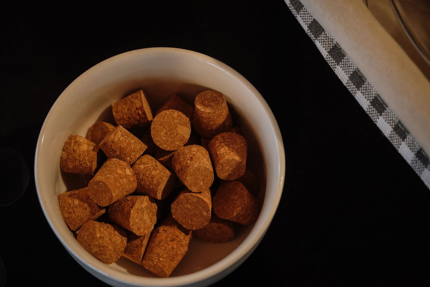 Brown sugar cubes dissolving in a dark liquid shown in sequential photos.