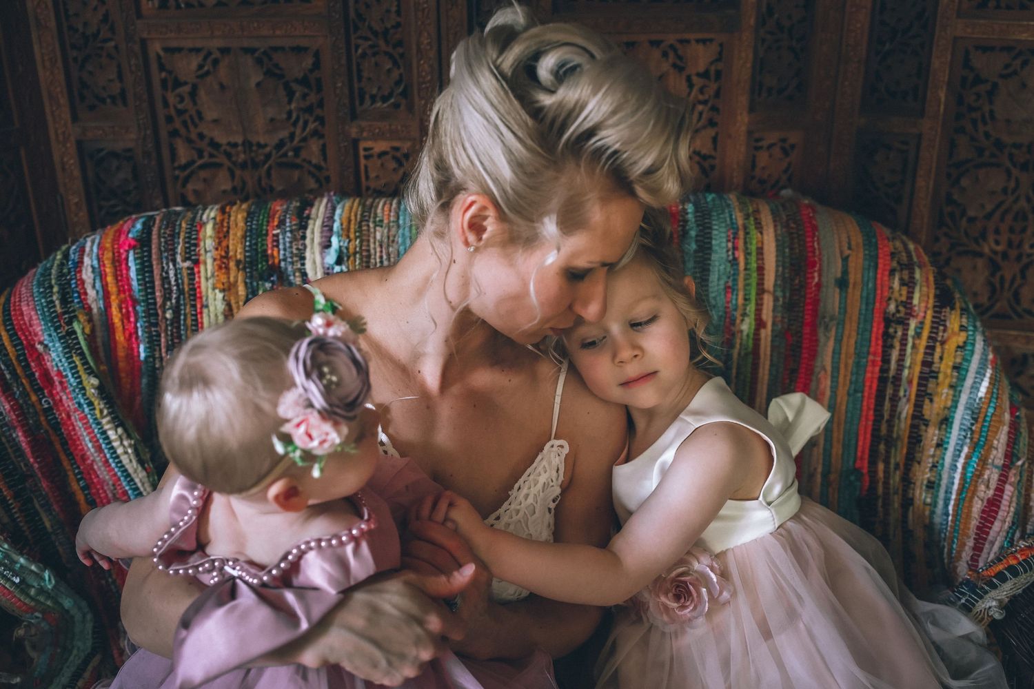 A series of tender romantic moments between a couple in formal wedding attire against colorful backgrounds.