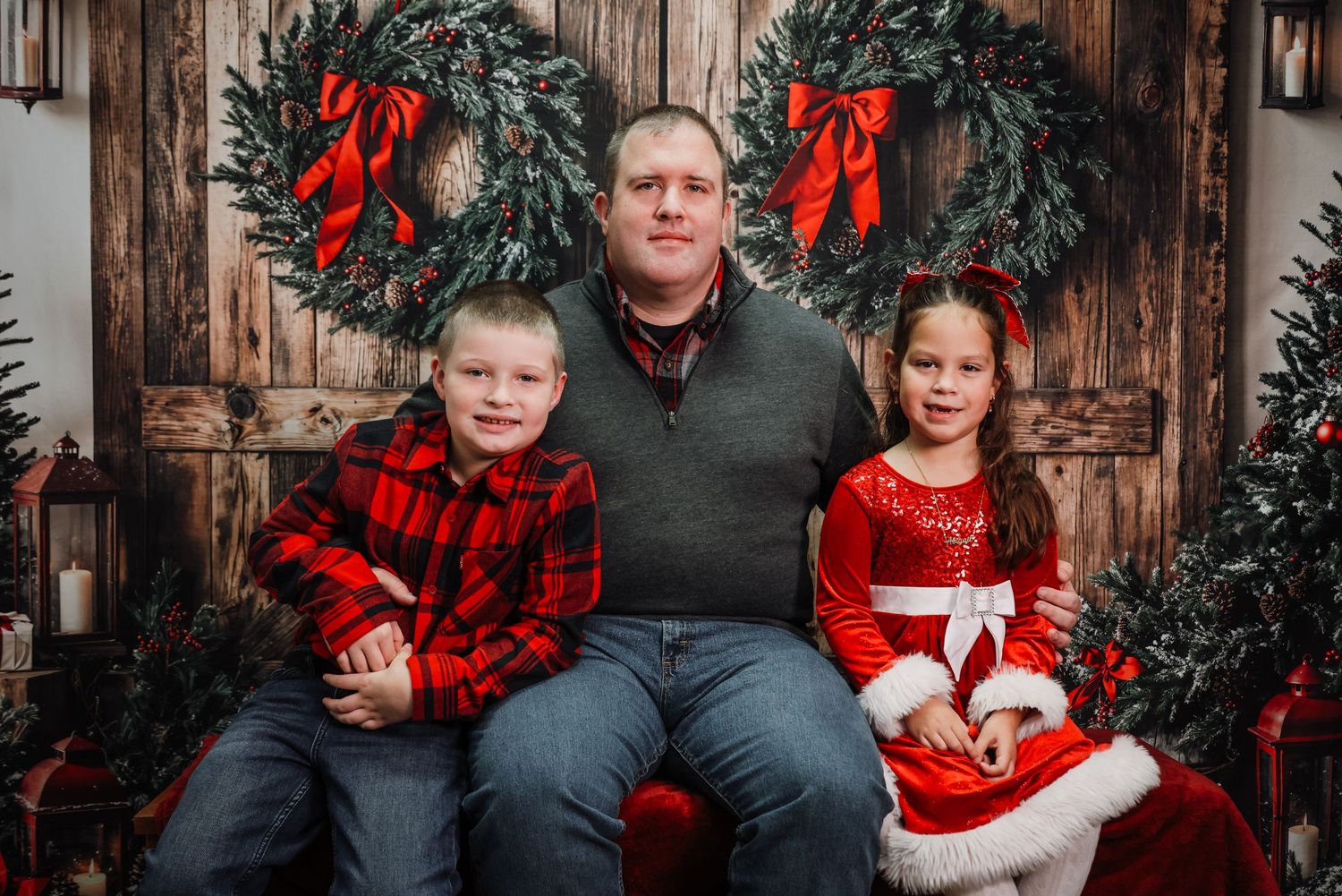 A festive holiday photo series with matching red and black buffalo plaid outfits against a rustic wooden backdrop.