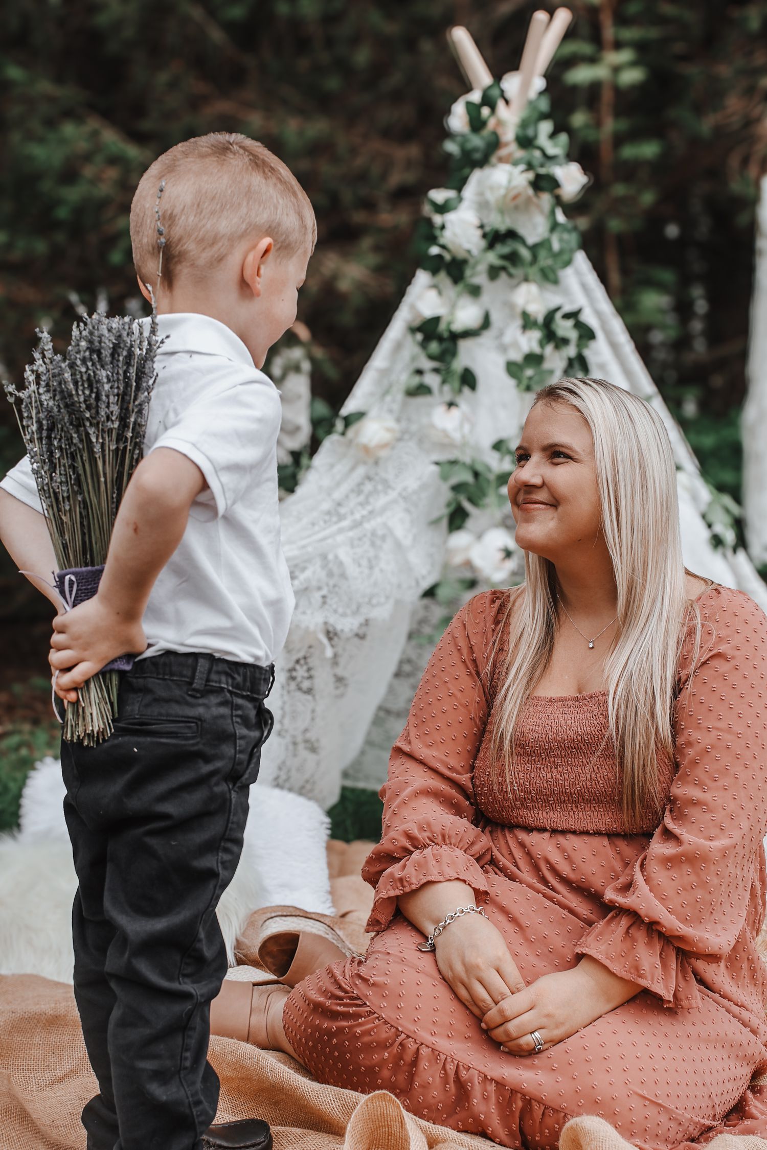 A series of outdoor maternity photos showing a pregnant woman in a peach dress with a young child in formal wear.