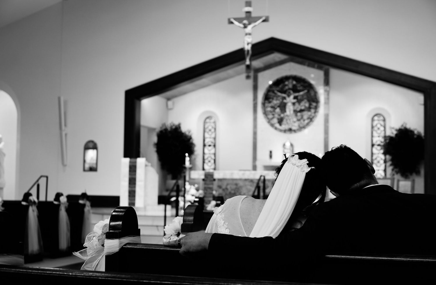 A black and white panoramic collage showing church buildings, silhouettes, and architectural elements against light backgrounds.