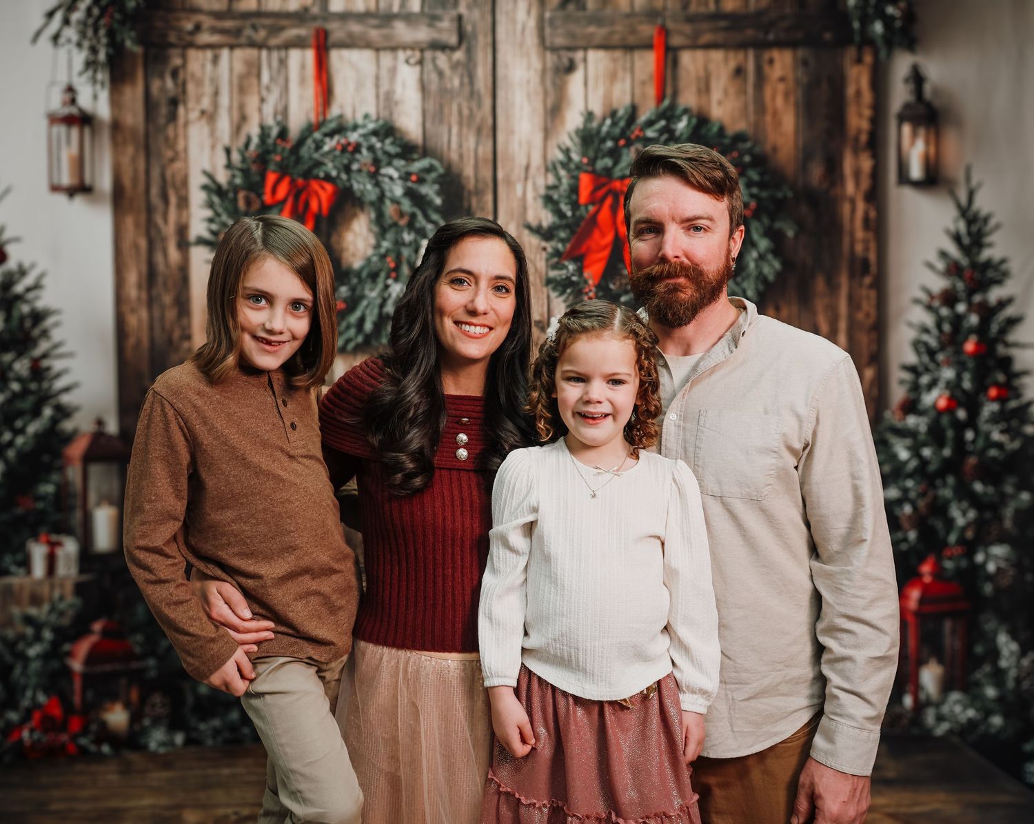 A festive holiday photo series showing a family in coordinating brown, burgundy and cream outfits against a rustic wooden backdrop.