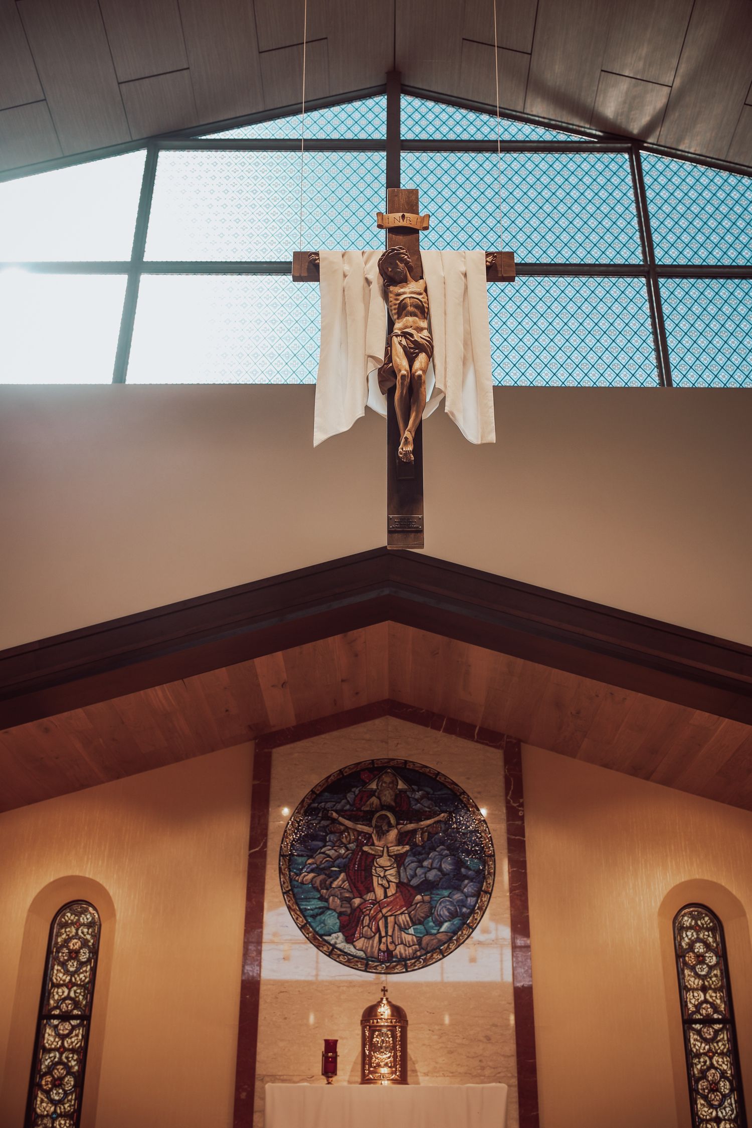 A series of panoramic views showing the interior architecture of a church with stained glass windows and wooden beams.