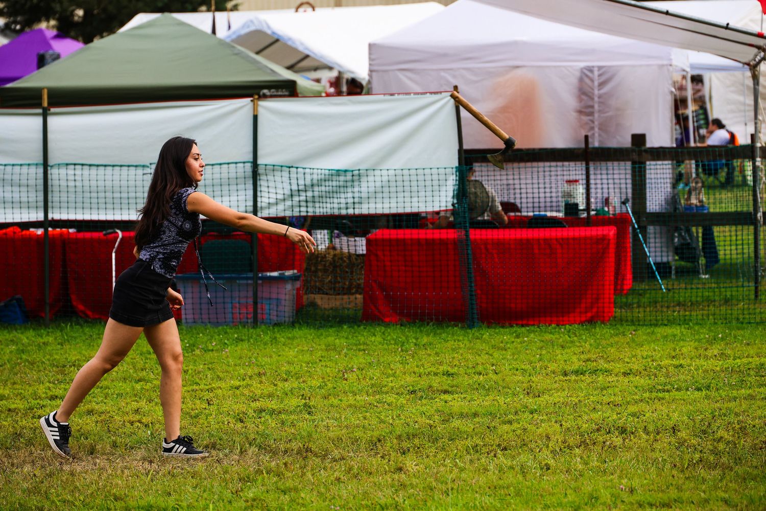 A series of photos showing a person in athletic gear practicing softball pitching technique on a grass field.