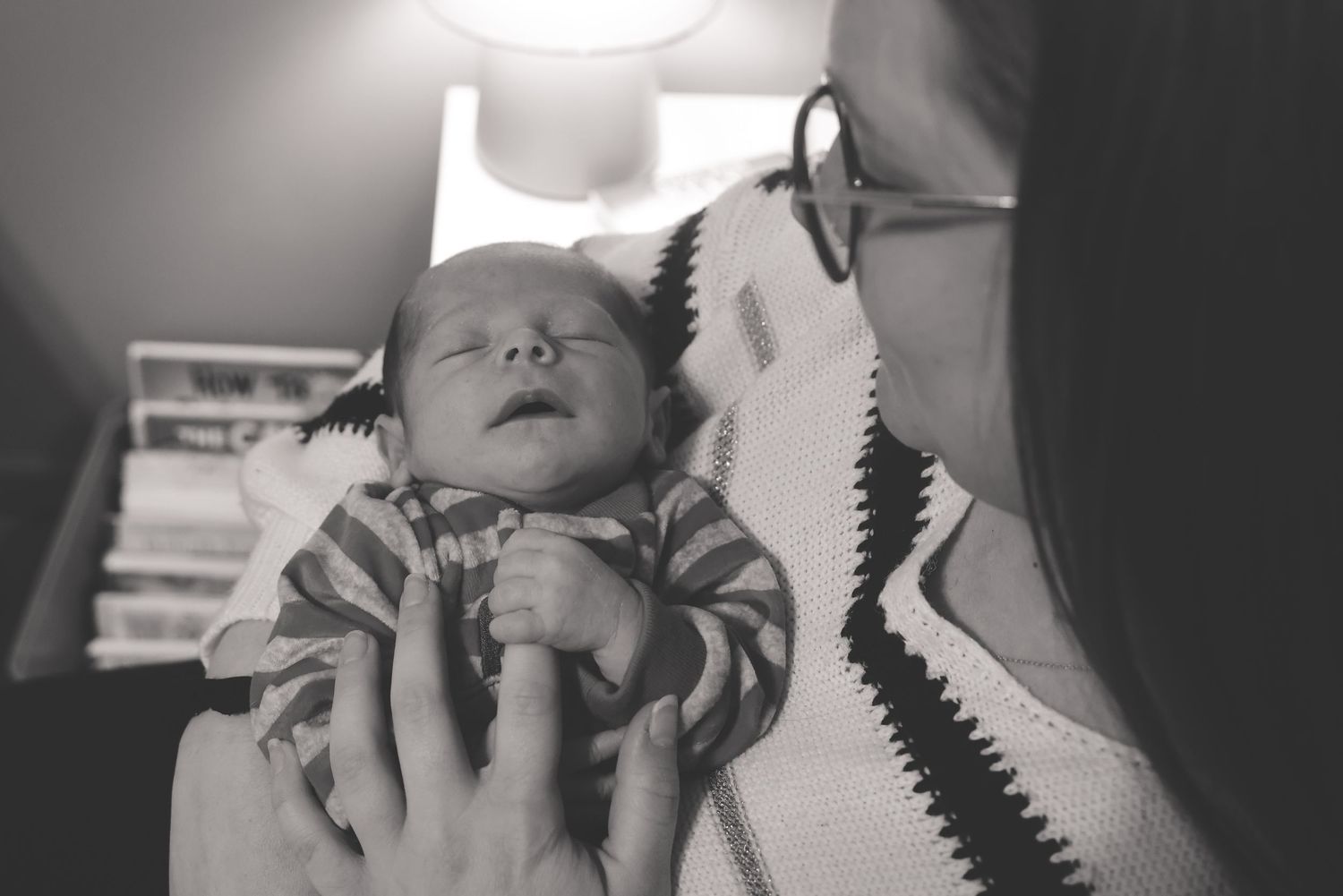 Black and white photo series showing a person's face and hands in various emotional expressions and poses.