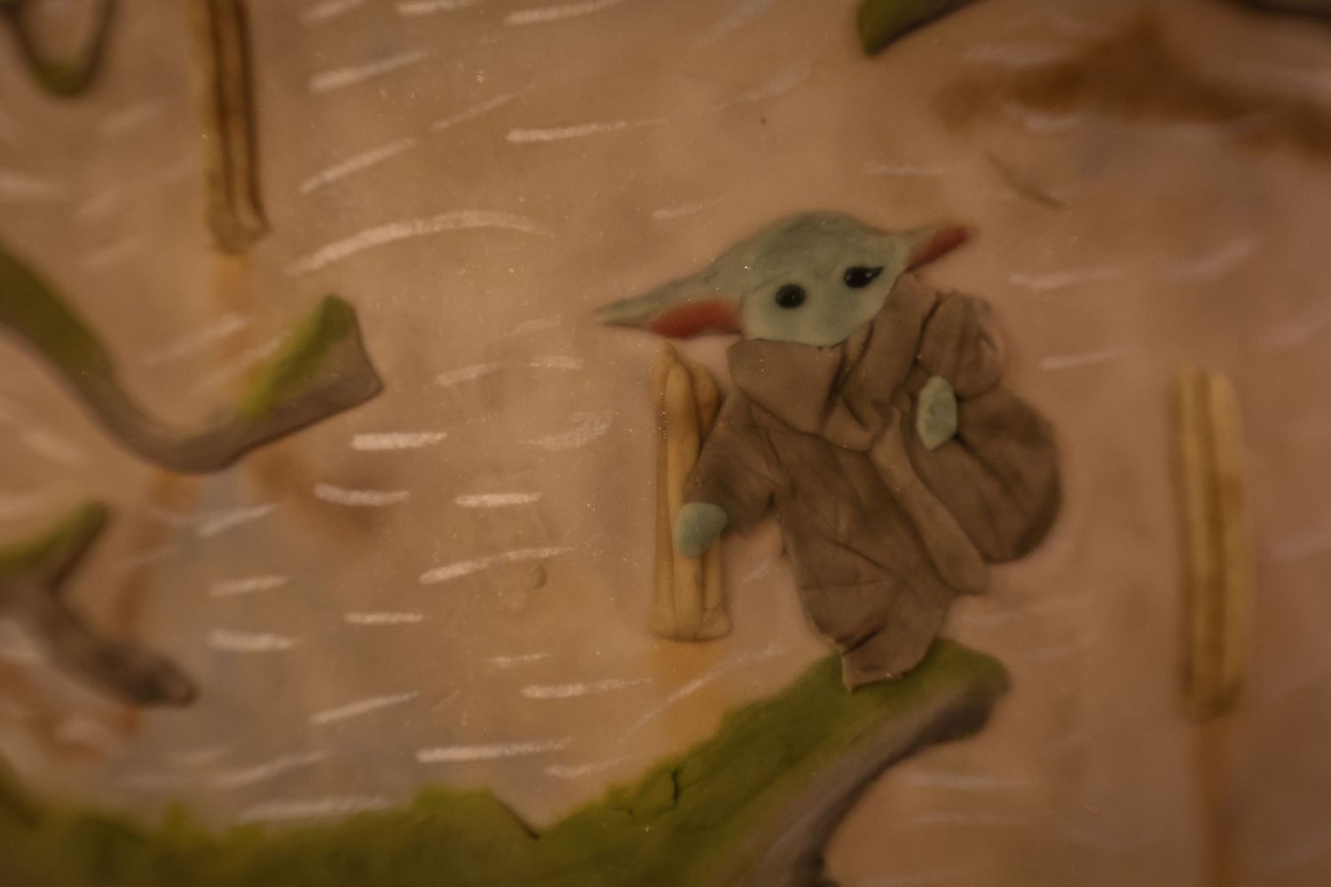 A series of images showing Baby Yoda character figures from The Mandalorian in different poses and angles.