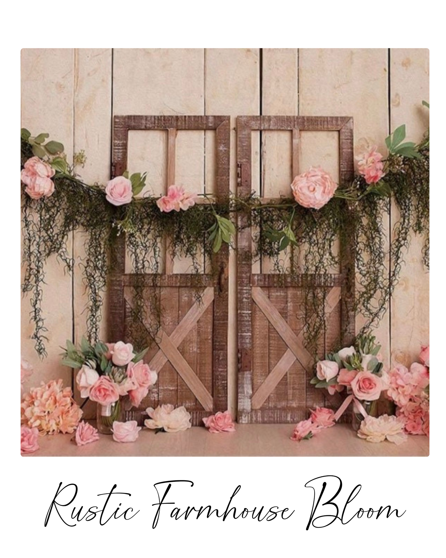 Rustic wooden barn doors decorated with pink roses and cascading greenery against a light wooden backdrop create a farmhouse scene.