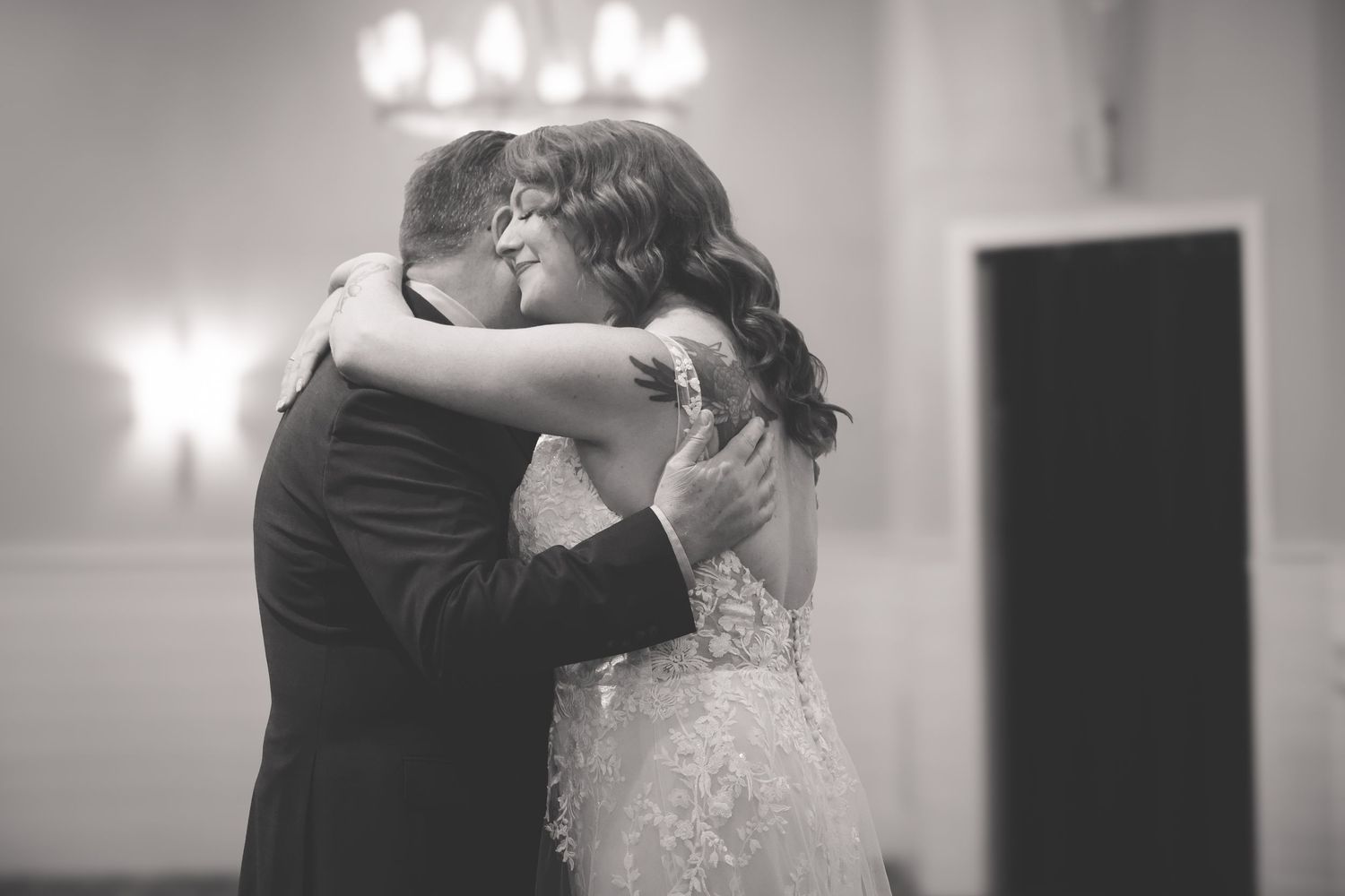 Black and white photo series showing romantic dance moments between a couple at their wedding reception.