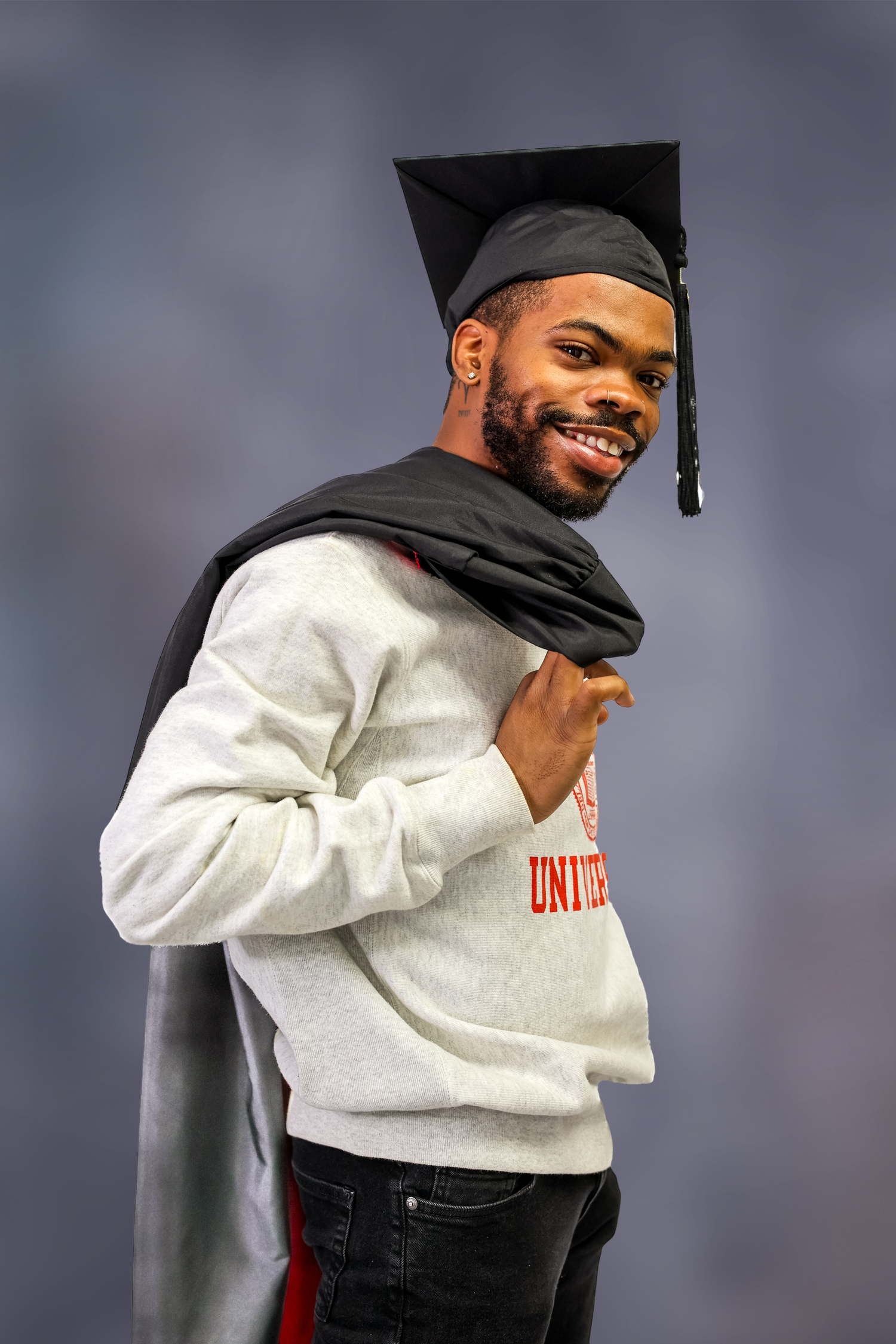 A series of five photos showing someone in a white sweatshirt and black hat posing against a gray background.