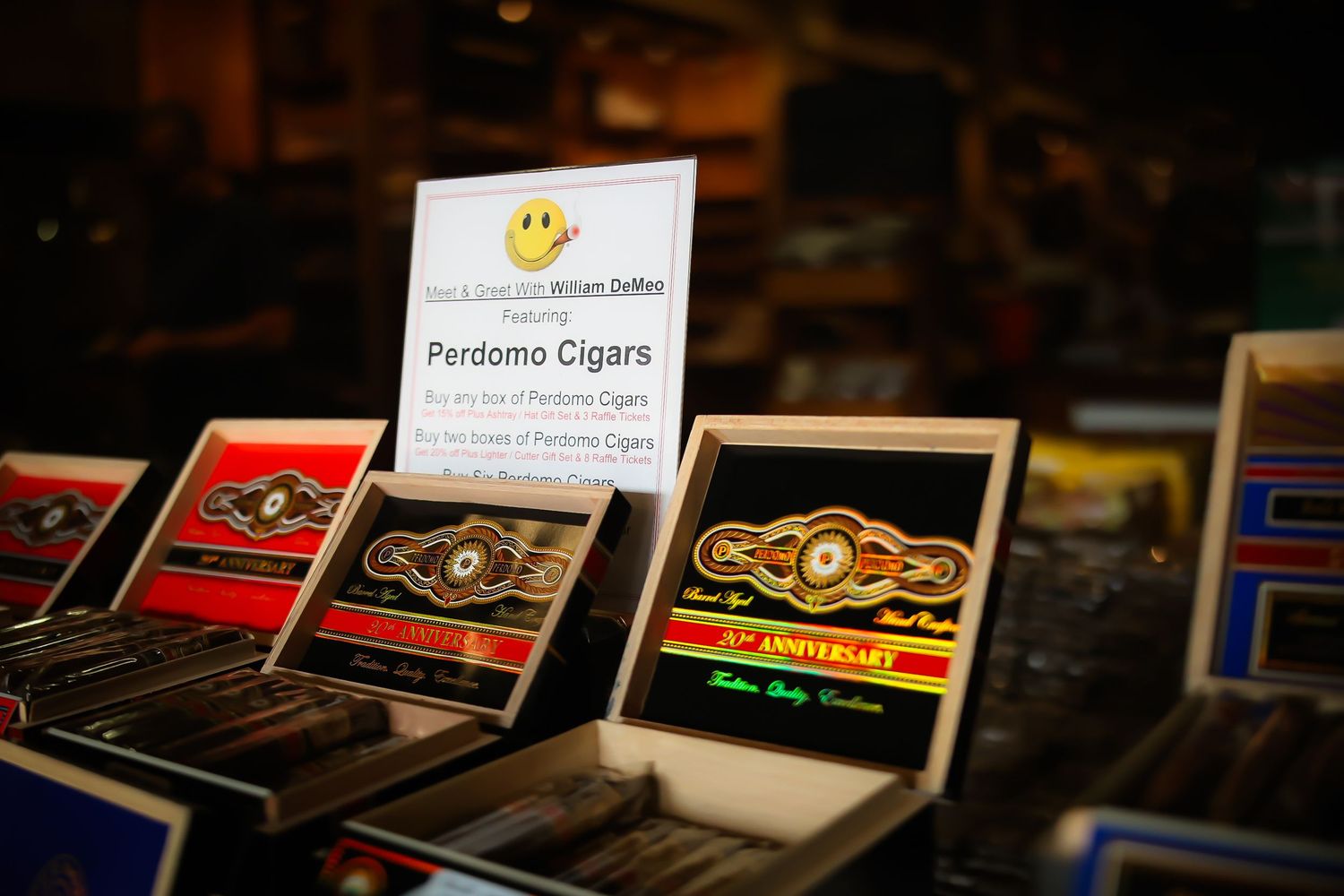 Rows of premium cigar boxes displayed on dark wooden shelves in a tobacco shop.