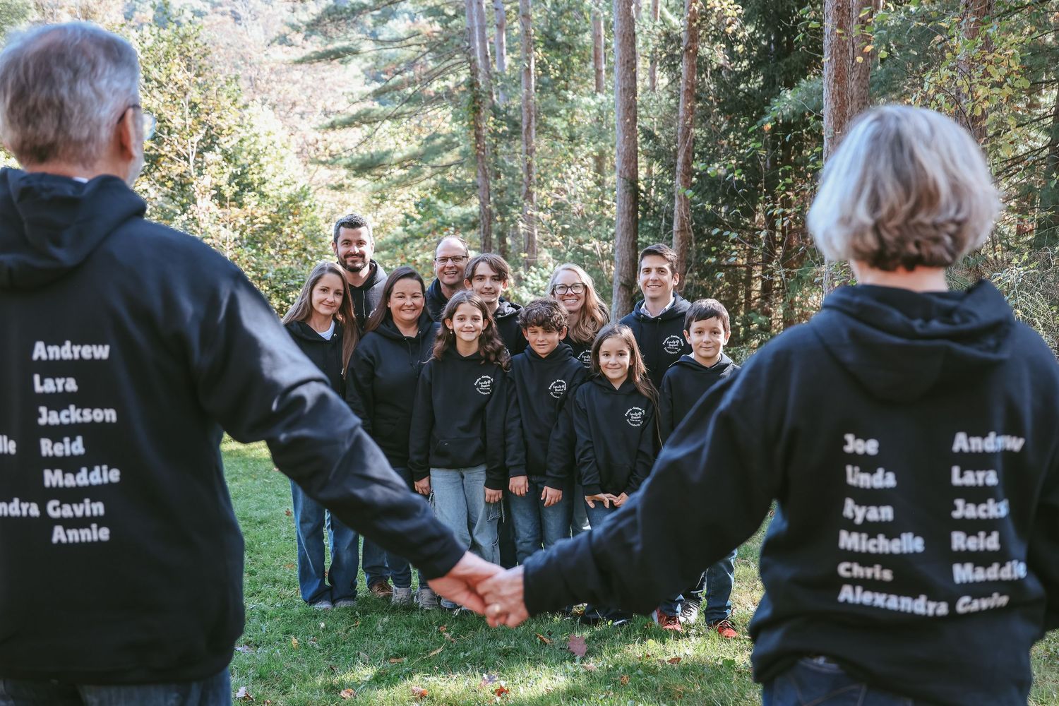 A series of candid outdoor group photos showing people gathered in a natural setting with trees in the background.
