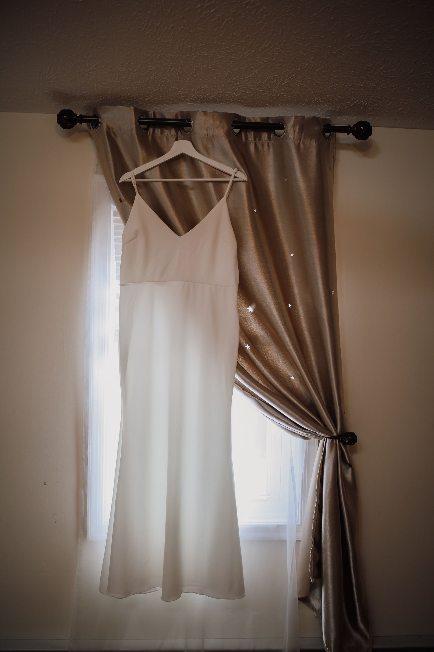 A series of window curtains showing different arrangements of white sheers and tan drapes in natural lighting.