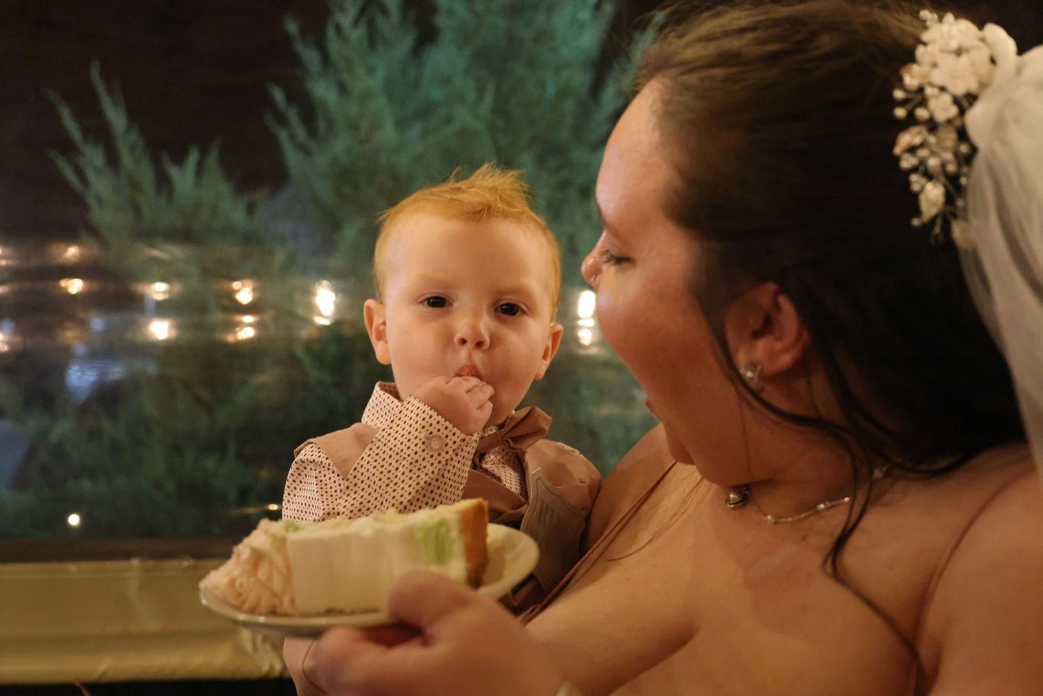 A sequence of photos showing a child blowing out birthday candles on a cake during a nighttime celebration.