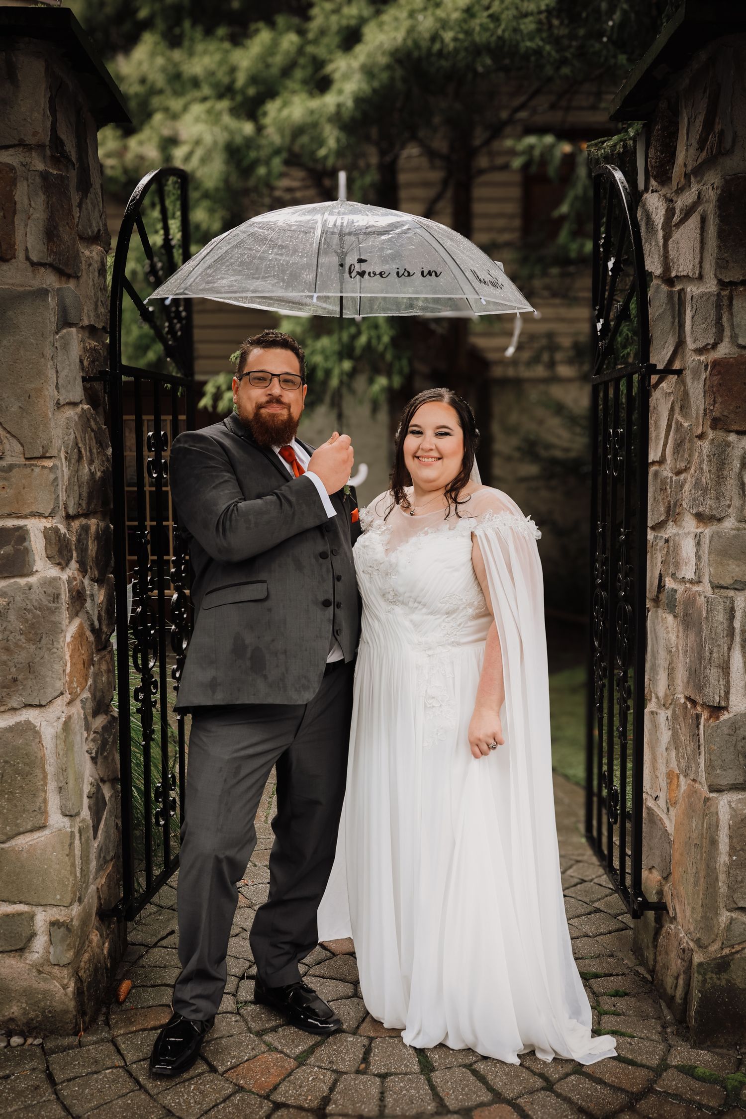 A series of romantic wedding photos showing a couple in white dress and dark suit posing by a stone wall and iron gate.