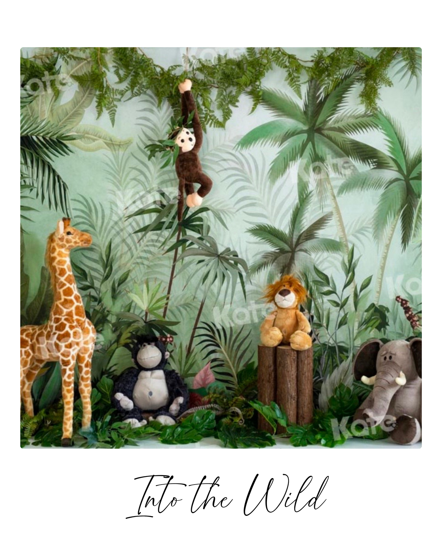Jungle-themed backdrop with stuffed animal toys including giraffe, gorilla, lion, elephant, and monkey among tropical palms.