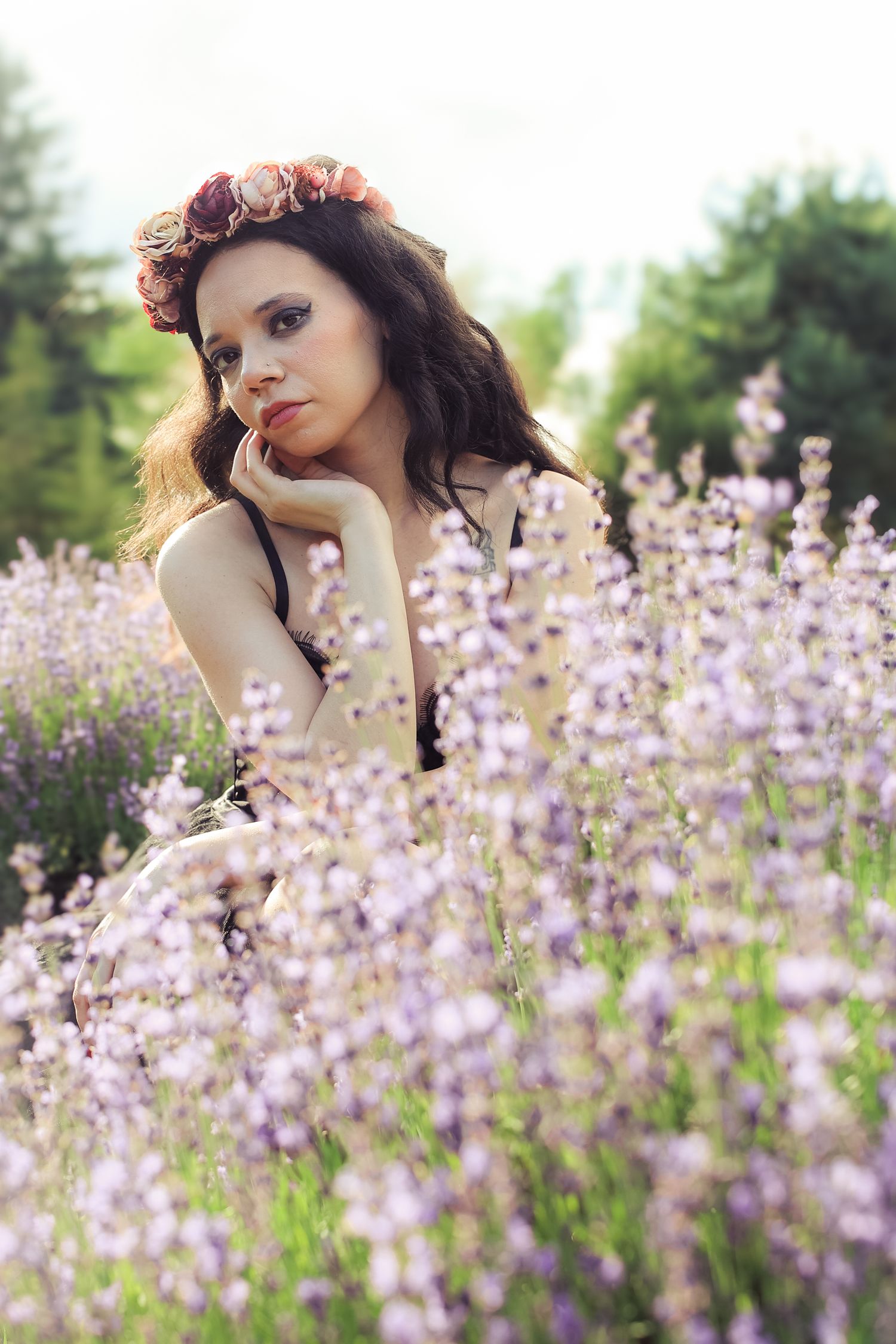 A dreamy portrait series in a blooming lavender field captures ethereal poses among the purple flowers.