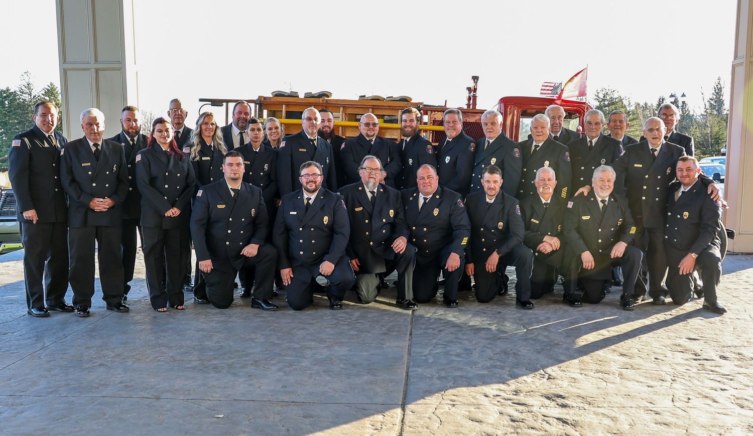 Group of uniformed personnel standing in formation during a military or law enforcement ceremony.