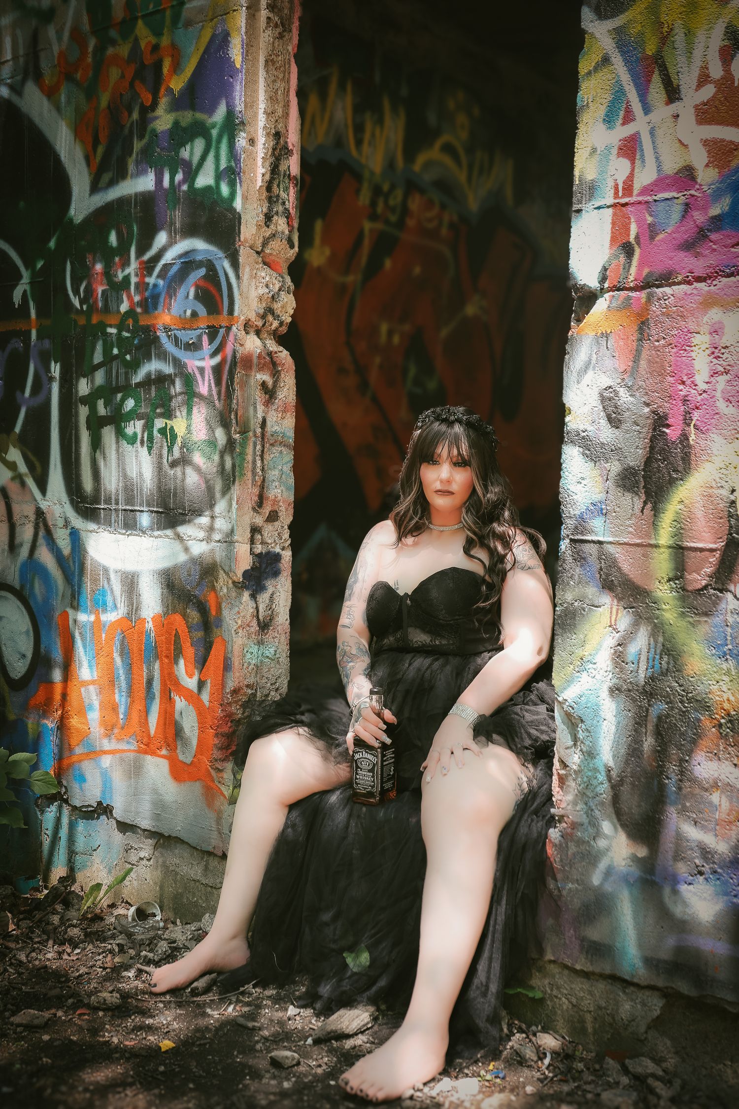 A series of artistic photos showing feet and legs against graffiti-covered walls in an abandoned urban setting.