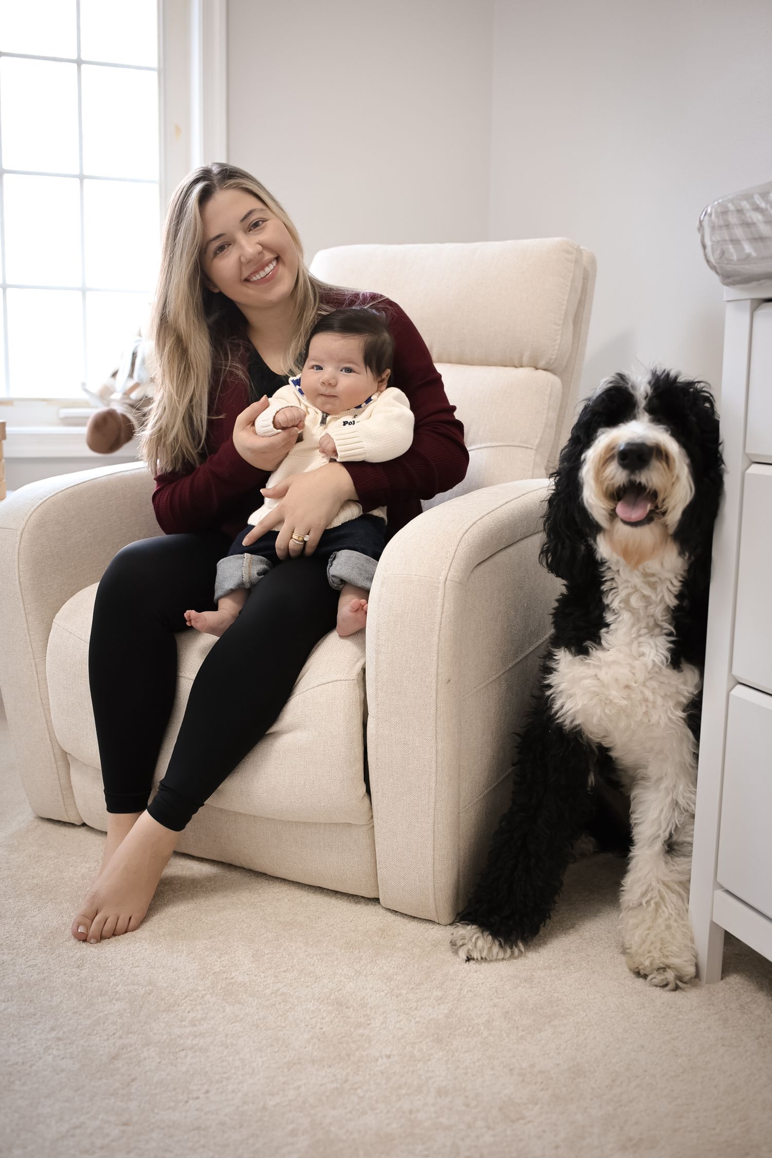 Four photos showing a black and white dog sitting on a beige couch with someone in a burgundy sweater.