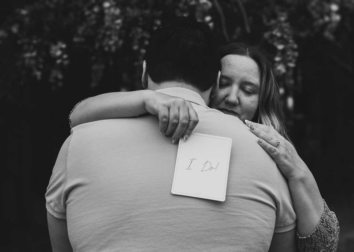 Black and white photo series showing close-up embraces and tender moments between a couple during an intimate session.