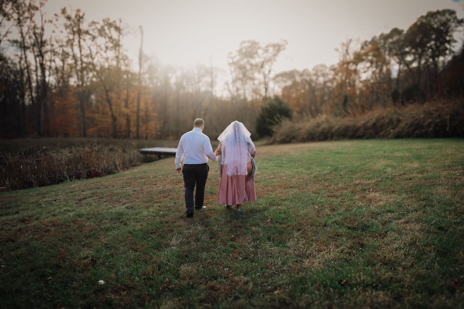 A collection of outdoor engagement photos showing a couple walking through autumn fields at sunset.