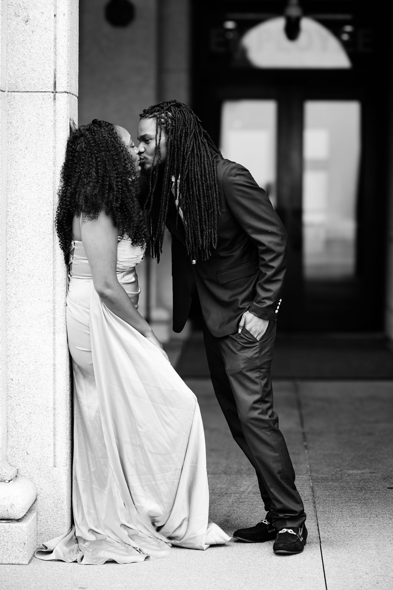 A black and white artistic wedding photo series showing intimate moments between a bride and groom in formal attire.