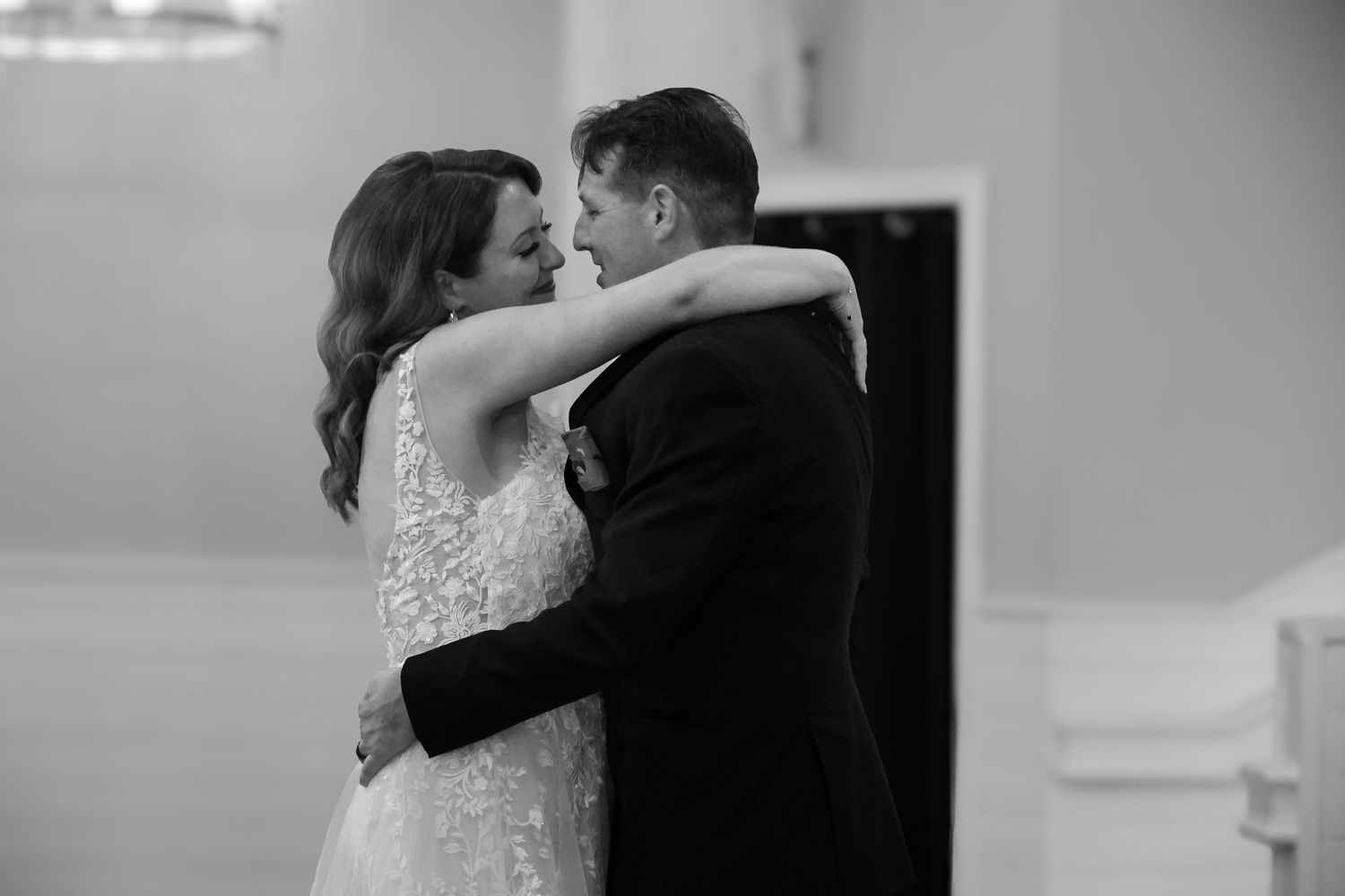A romantic black and white wedding dance sequence showing multiple intimate moments between the bride and groom.