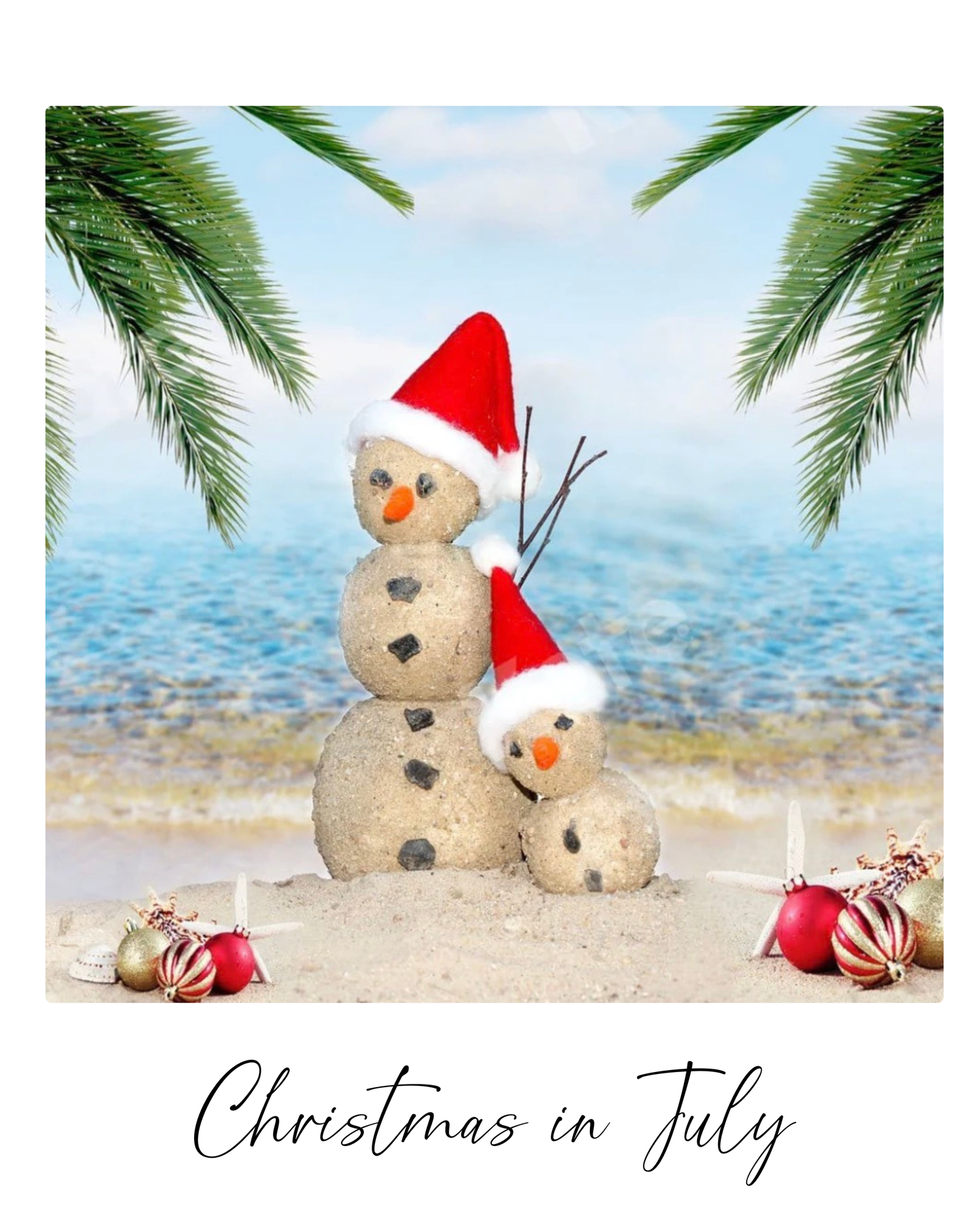 Sand snowman with Santa hat and seashell decorations sits on tropical beach with palm trees and Christmas ornaments.