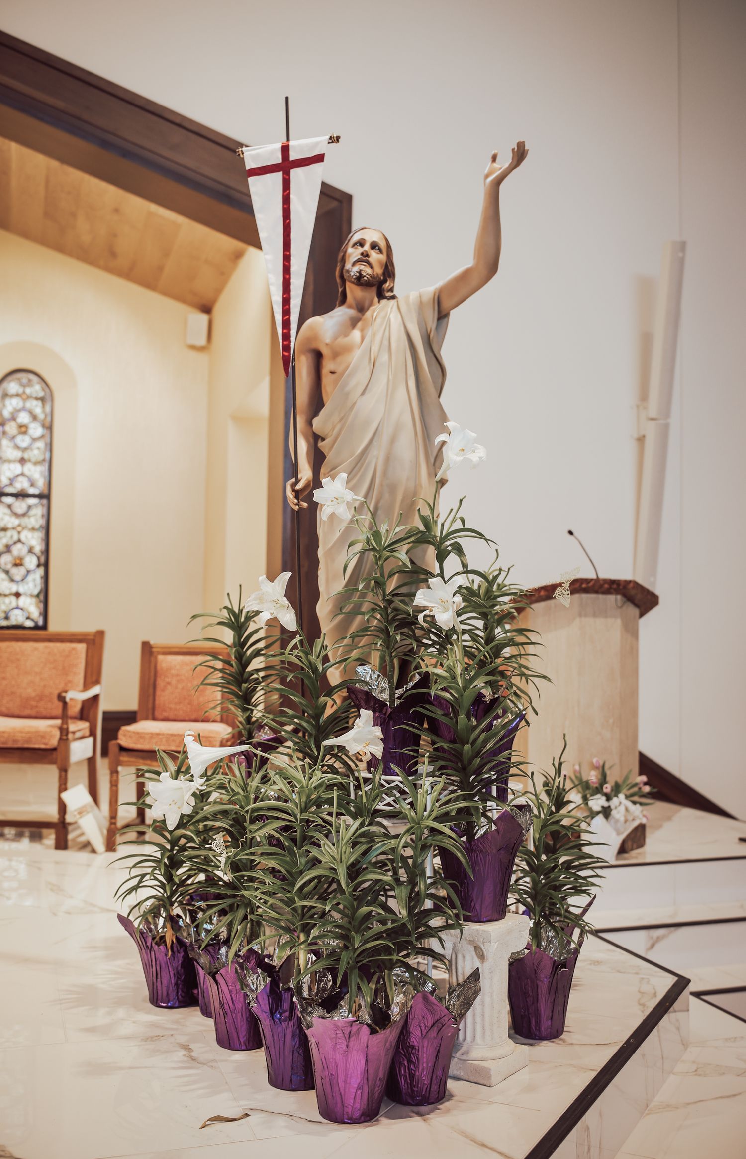 A series of five sequential photos showing a person dancing expressively in a church interior with purple potted plants.