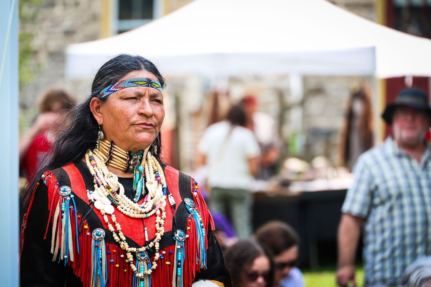 A collage of Native American cultural celebration images showing traditional dress and regalia at a powwow gathering.