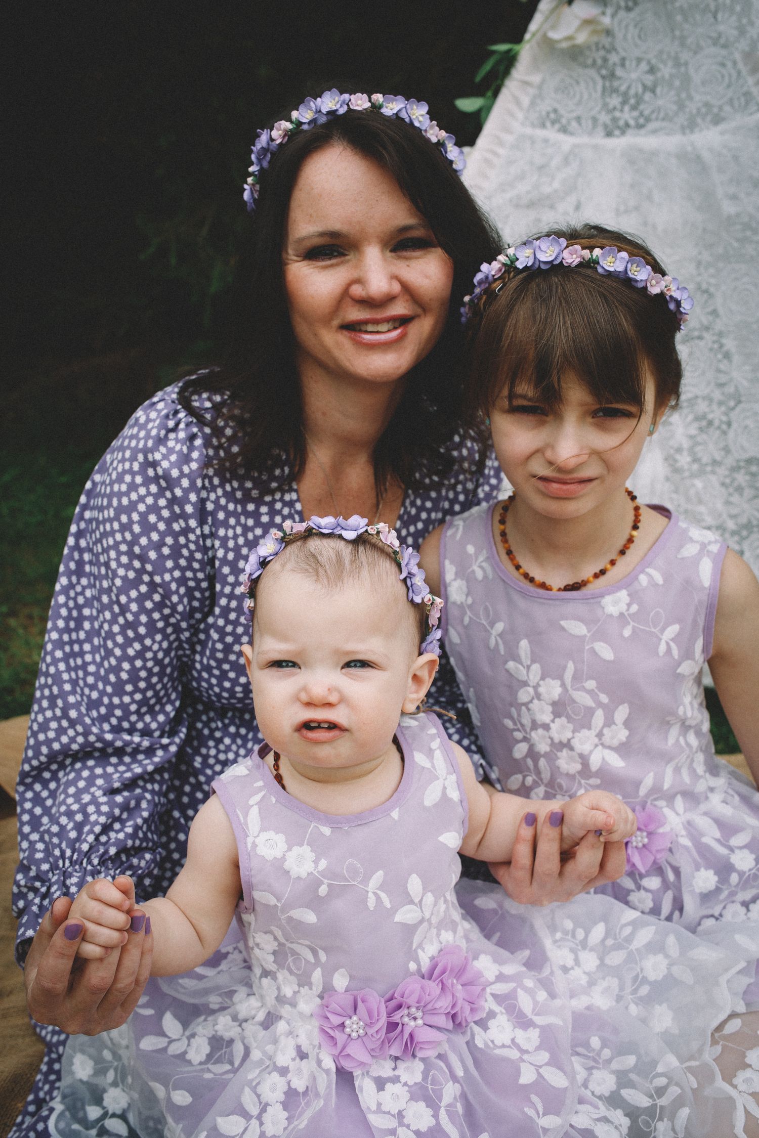 A series of candid photos showing people in coordinating purple and lavender floral outfits sitting together outdoors.