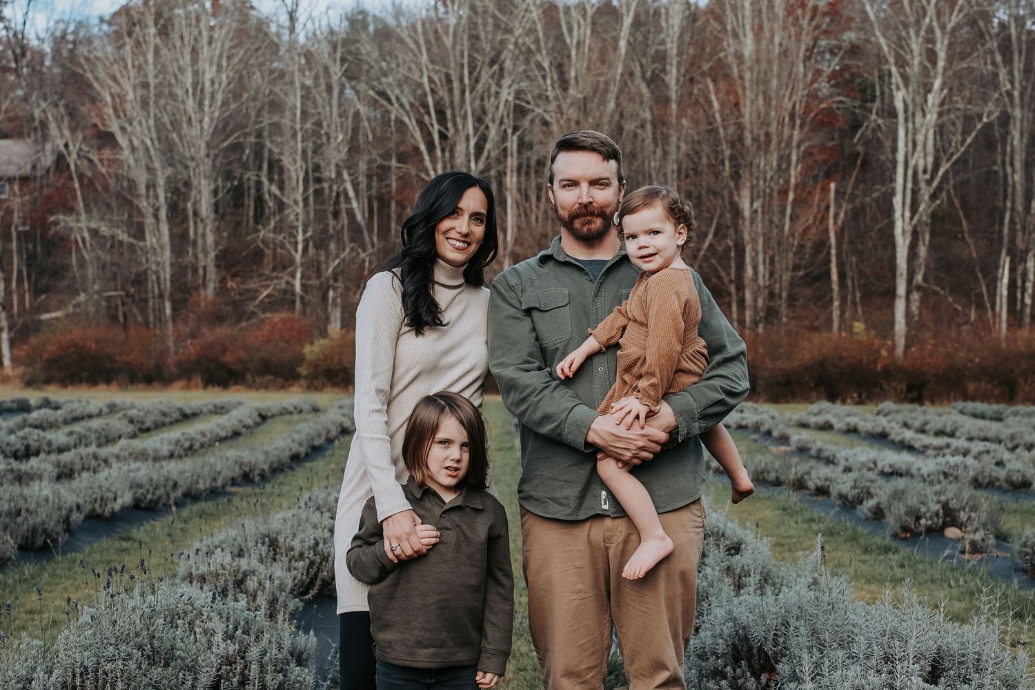 A series of outdoor family portrait photographs taken in a rustic natural setting with birch trees and lavender fields.