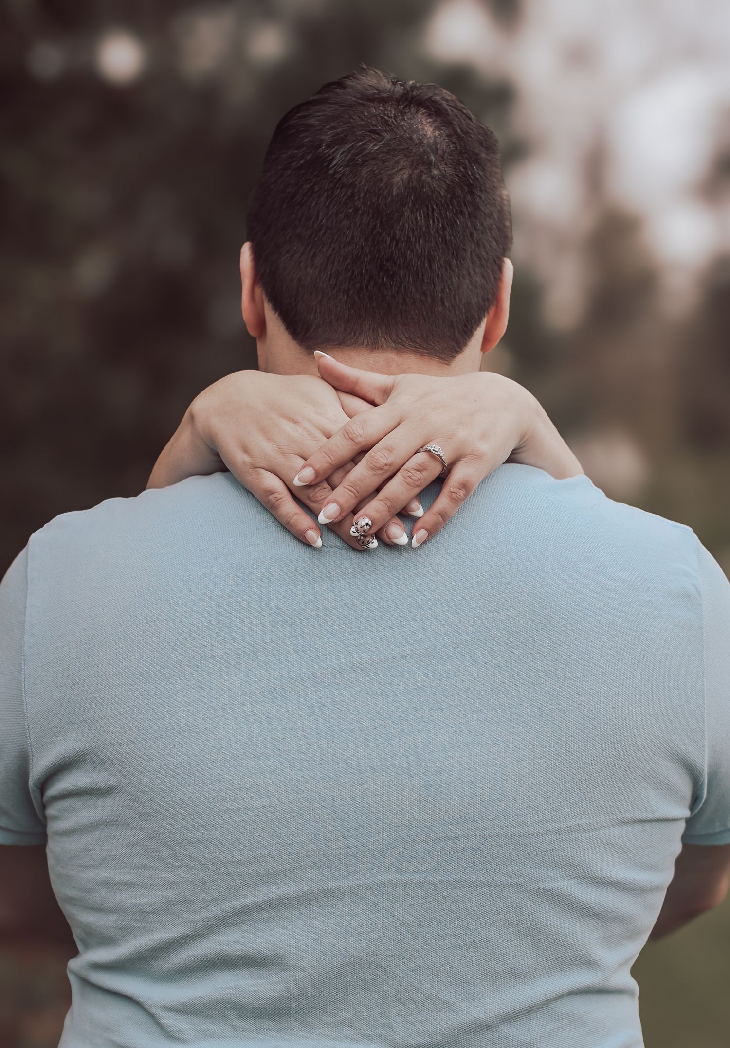 A series of photos showing hands clasped behind someone wearing a light blue shirt, viewed from behind.