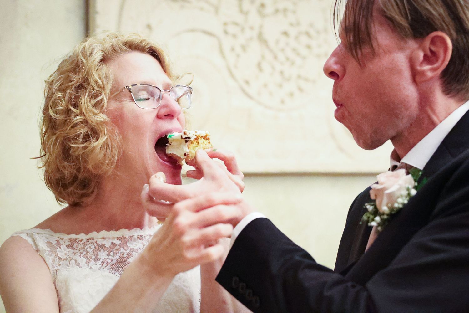 A series of photos showing a bride and groom sharing a cupcake during their wedding celebration.