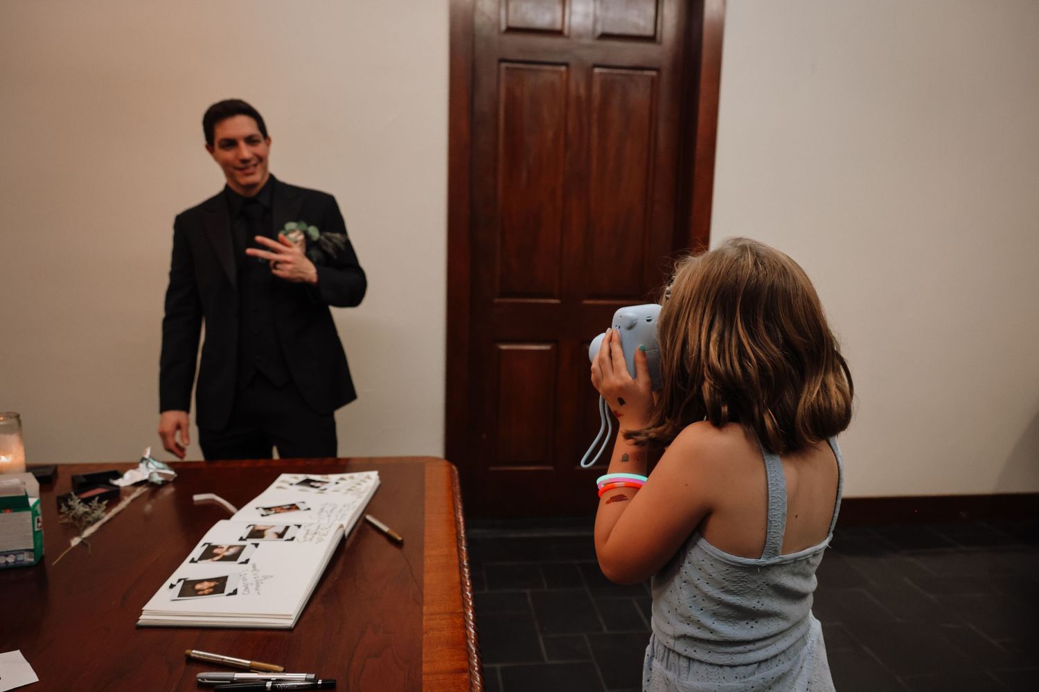 A series of photos showing a person signing documents and interacting with others in an office setting.