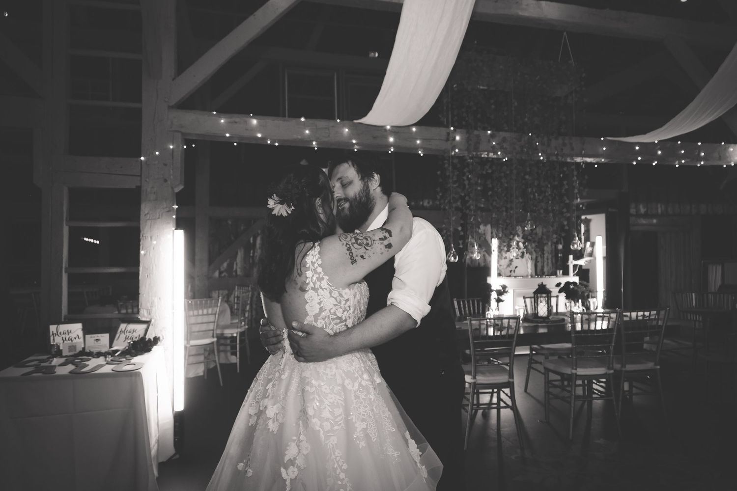 A black and white photo sequence shows couples dancing together at a dimly lit wedding reception.
