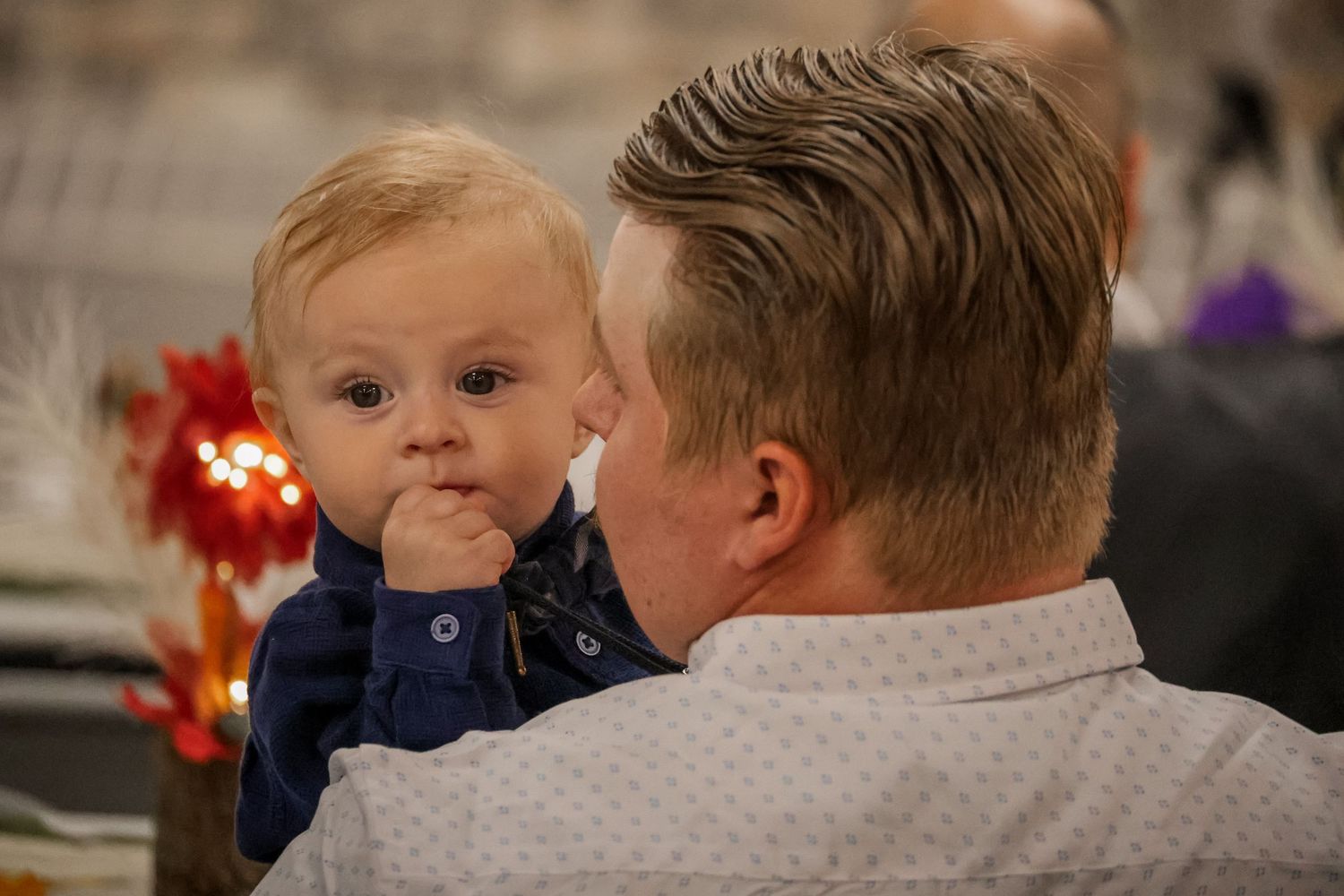 A series of candid family moments captured in warm indoor lighting during a special occasion.