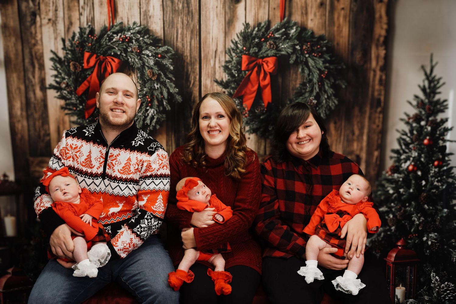 A festive family holiday photo collage with matching red and black plaid outfits against a rustic wooden backdrop.