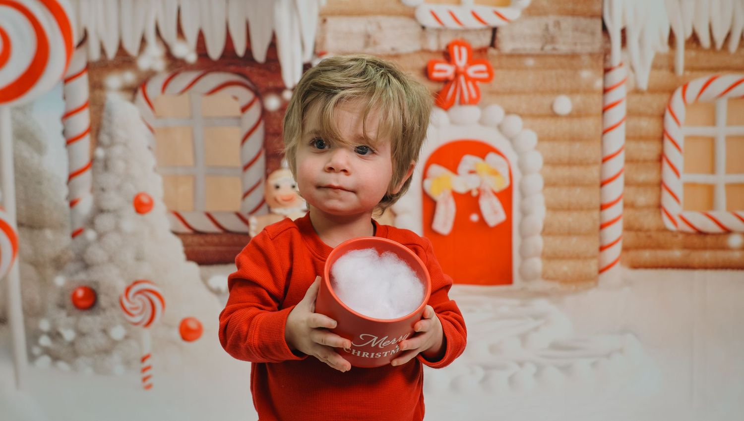 A festive holiday scene with red and white decorations, candy canes, and winter wonderland elements.