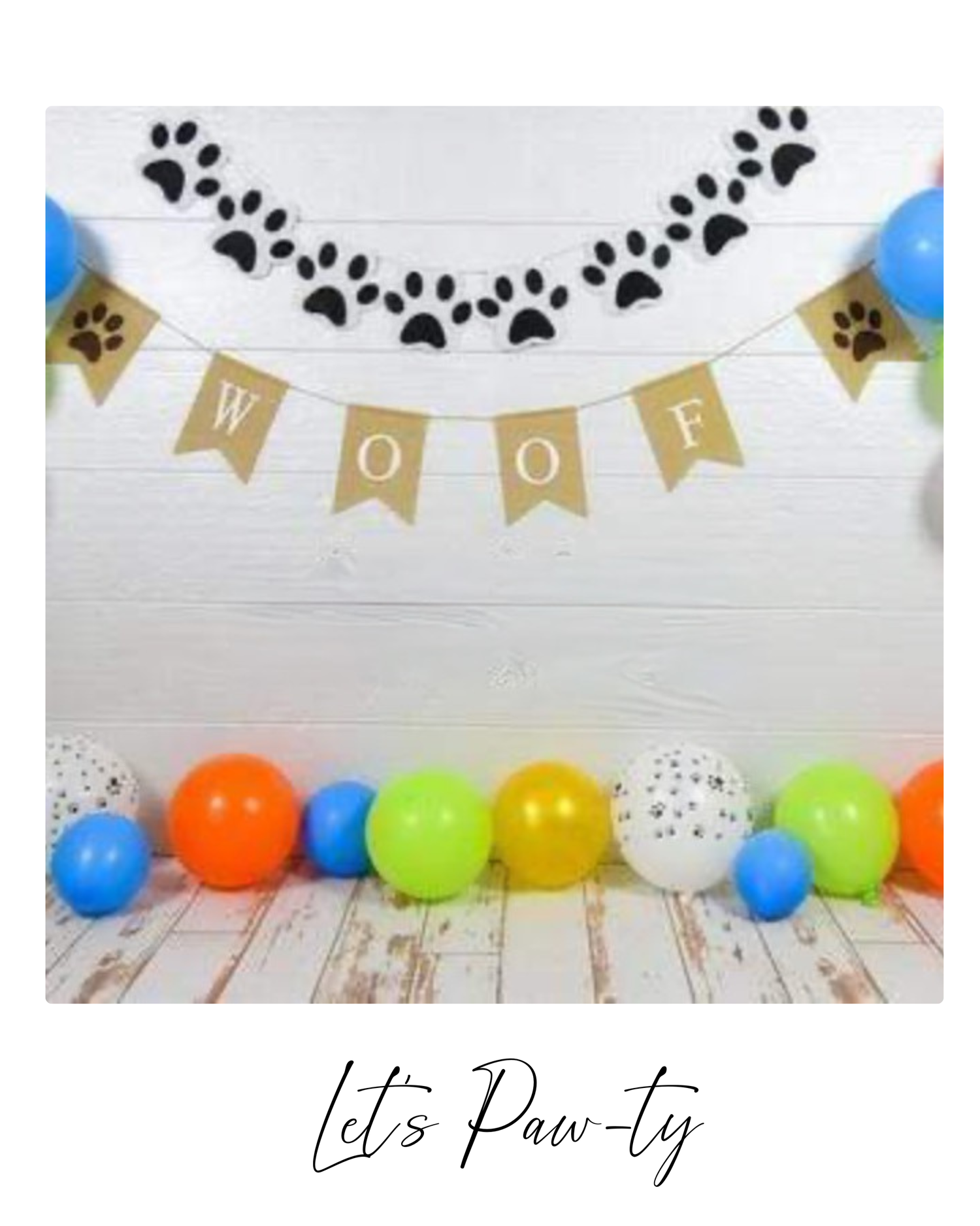 Festive party banner with paw print decorations and colorful balloons arranged against a white wall.
