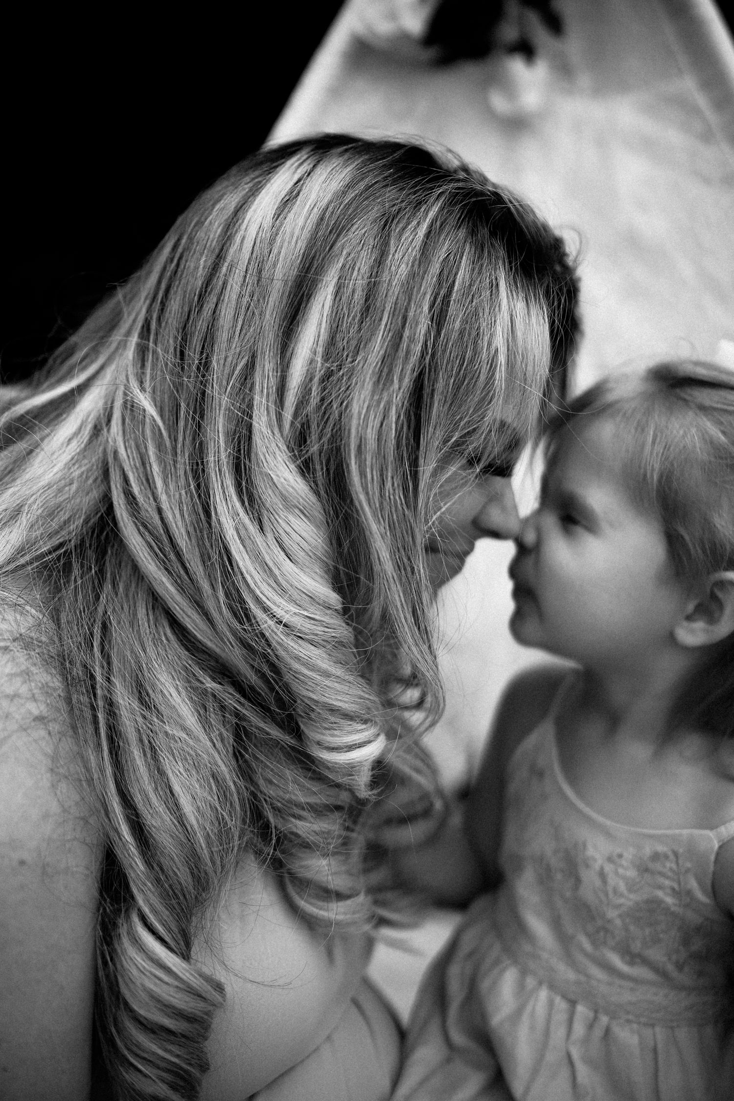 A black and white artistic photo series showing an intimate romantic moment between two people.