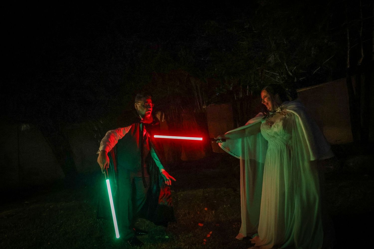 A series of nighttime photos showing glowing lightsabers illuminating dark outdoor scenes with ethereal effects.