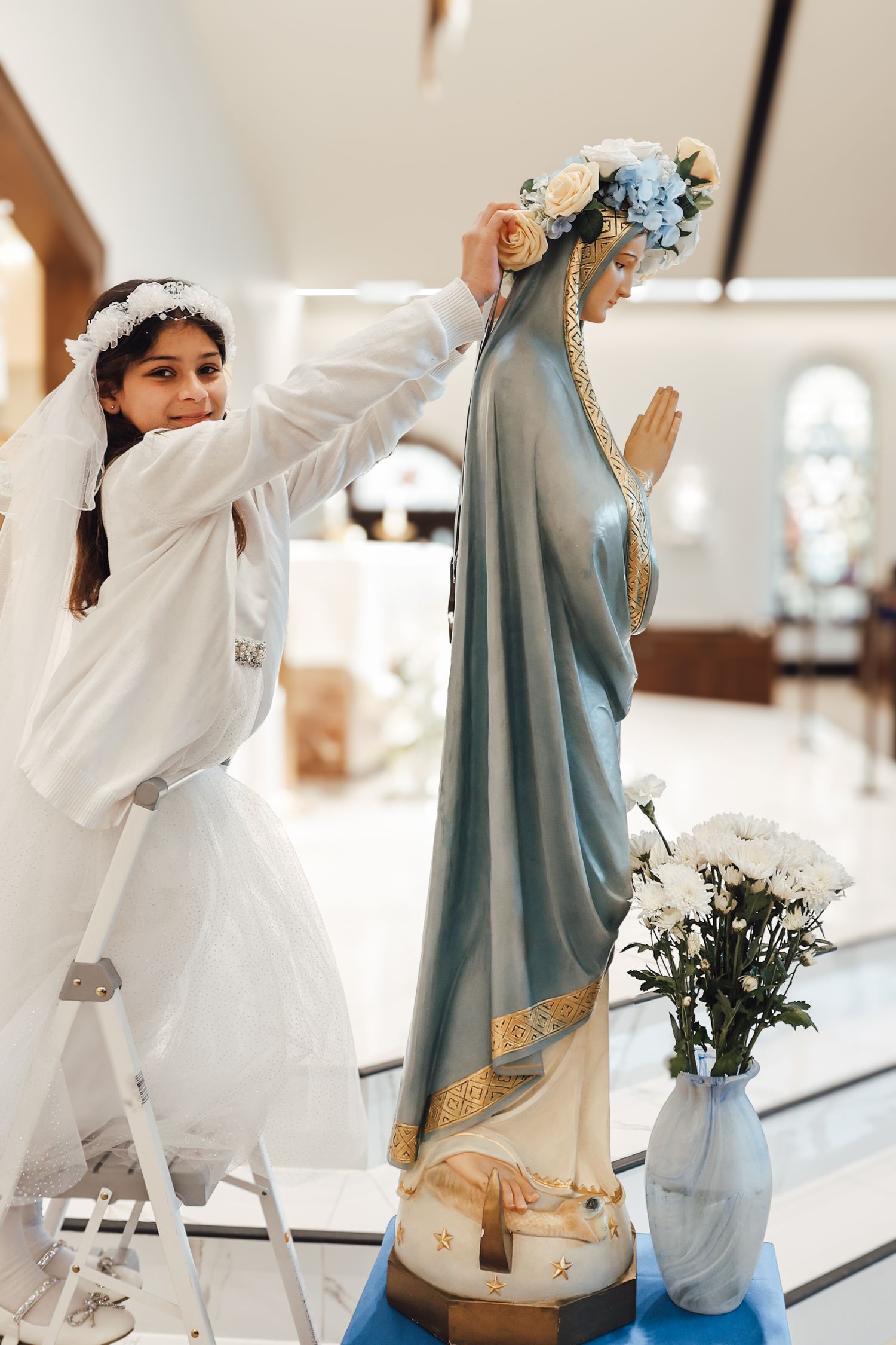 A series of photos showing someone in white dancing with a partner wearing a light blue outfit in an indoor space.