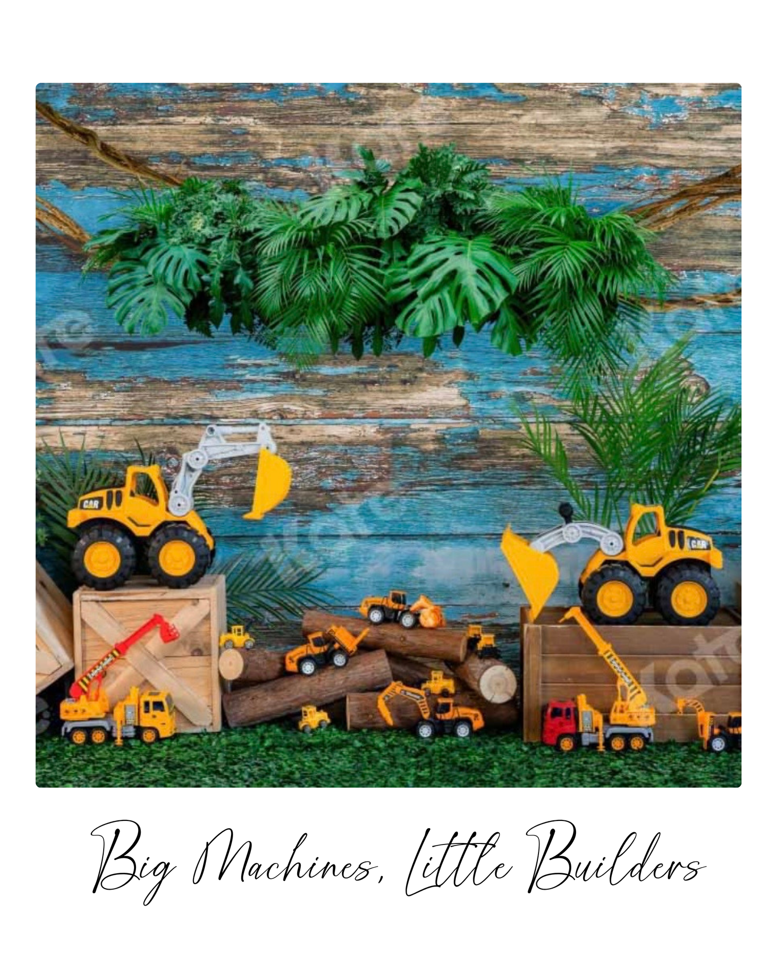 Toy construction vehicles and excavators arranged with wooden crates and tropical leaves on a rustic blue wood backdrop.