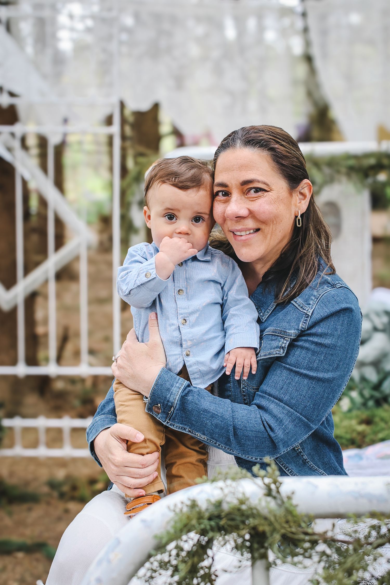 A series of candid outdoor portraits showing tender moments between parent and child in casual denim attire.