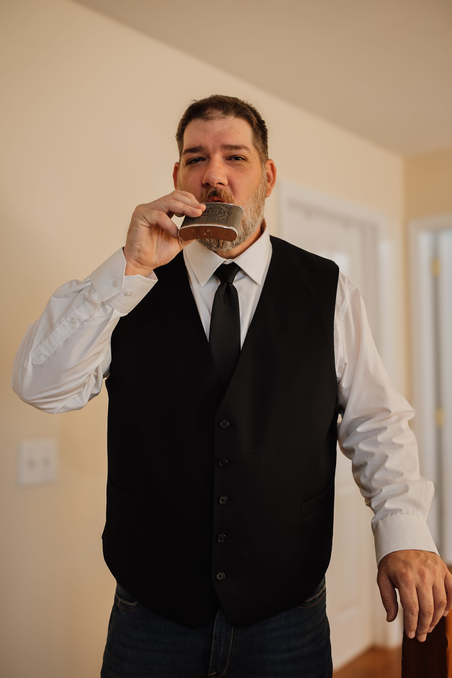 A person in formal attire adjusts their tie while getting ready in a sequence of photos.
