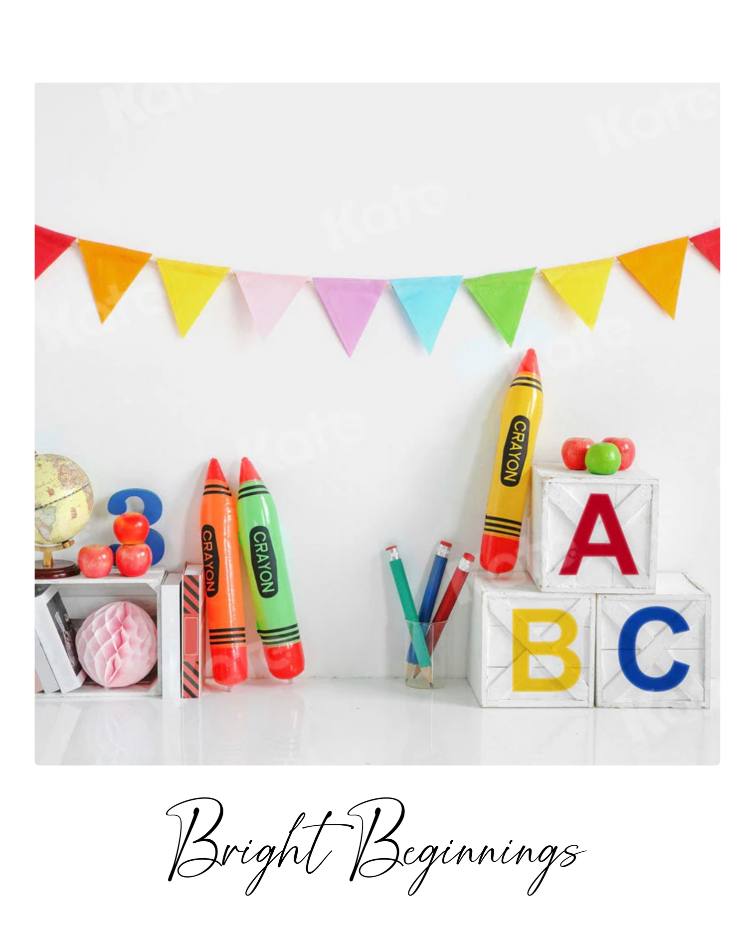Colorful school supplies and ABC letters arranged in a creative flat lay composition with festive bunting decoration.