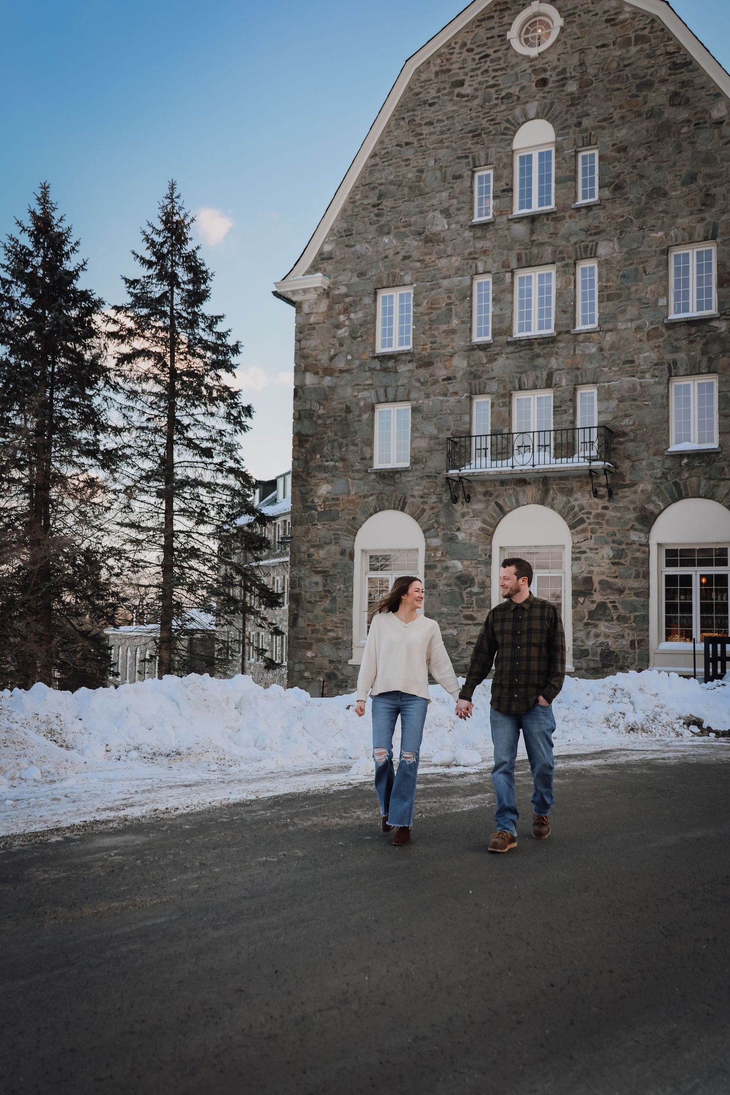 A series of four winter photos showing people walking outside a rustic stone building with snow banks along the walls.