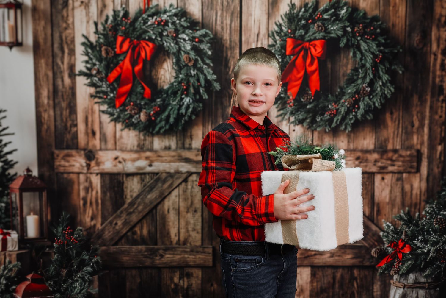 Holiday scene with buffalo plaid shirt against rustic wooden backdrop with evergreen wreaths and Christmas decorations.
