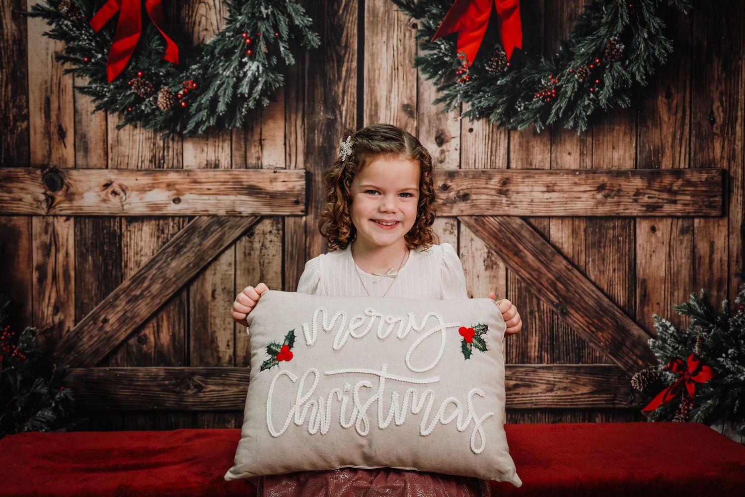 A series of holiday photos with red bows and evergreen decorations against a rustic wooden backdrop.